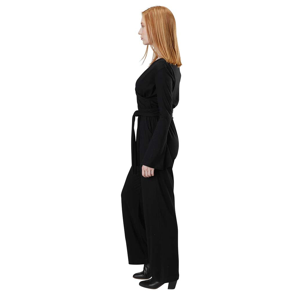 Women's Organic Cotton and Tencel Lightweight Jersey Long Sleeve Surplice Belted Jumpsuit in Black - Side View